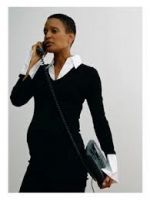 A pregnant woman on the telephone applying for a job